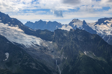 Panorama of mountains scene with dramatic blue sky in national park of Dombay