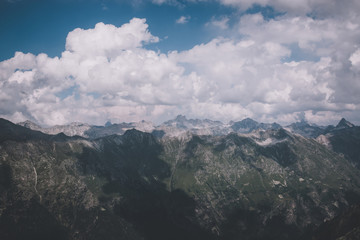 Panorama of mountains scene with dramatic cloudy sky in national park of Dombay