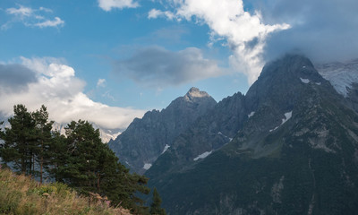 Panorama of mountains and forest scene in national park of Dombay, Russia