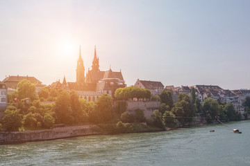 View on Basel city and river Rhine, Switzerland. People swim in water