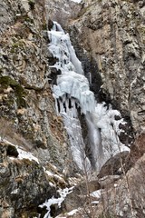 Fototapeta na wymiar Frozen Gveleti Large Waterfall Portrait, Georgia