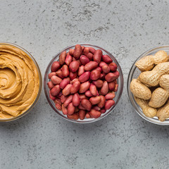Bowls with peanuts and peanut butter