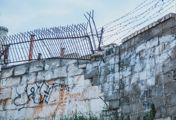 Fototapeta premium Barbed sproves on the fence prison
