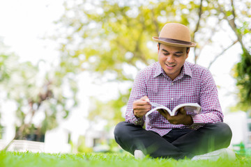 man reading a book.
