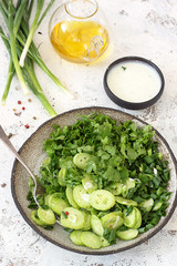 Fresh salad with armenian cucumber, green onions and herbs