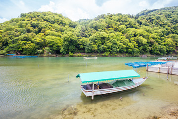 Fototapeta na wymiar Boats on Katsura River Arashiyama Kyoto
