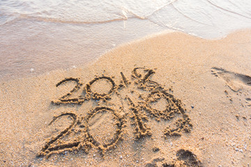 2019 hand write on sea beach new life new year