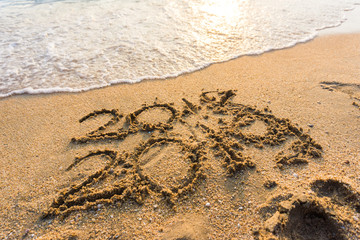 2019 hand write on sea beach new life new year
