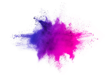Freeze motion of colorful color powder exploding on white background.  Paint Holi.