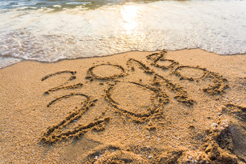 2019 hand write on sea beach new life new year