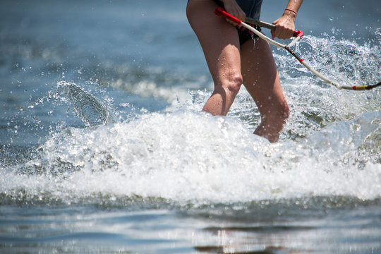 Slim Woman Riding Wakeboard In Summer