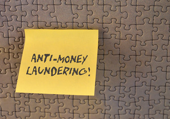 Writing note showing Anti Money Laundering. Business concept for stop generating income through...