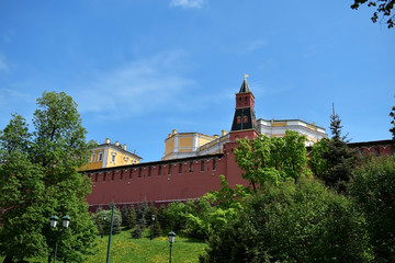 Moscow, Russia - May 13, 2019: The Middle Arsenalnaya Tower surrounded by verdure against the clear...