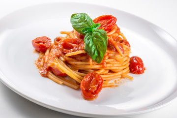 Plate of spaghetti with tomato and basil