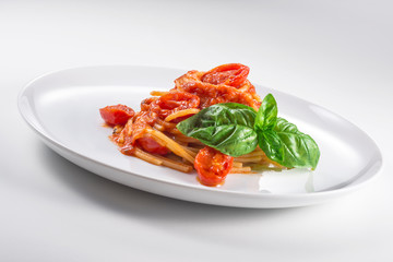 Plate of spaghetti with tomato and basil
