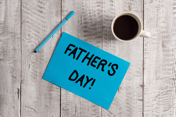 Conceptual hand writing showing Father S Day. Concept meaning day of year where fathers are particularly honoured by children Pastel Colour paper and pen with coffee cup on wooden table