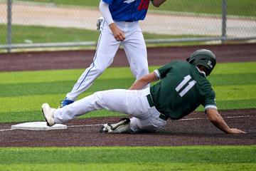 Young athletic boys playing baseball