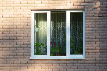 Fototapeta na wymiar Beautiful Plastic Windows in a multi-storey building.