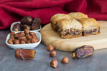 Turkish style vegan baklava or Antep baklava with nut,date fruit, pistachio for presentation and service and food photography. 