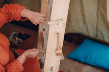 Woman makes thread, yarn and fabric