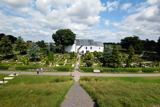 People visiting Jelling historical site as seen from Horms hill. Viking age runestones situated in front of the Church.