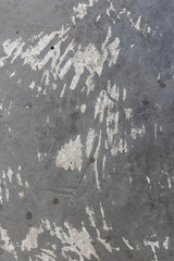 texture of an old grey cement wall with scratch and stain.
