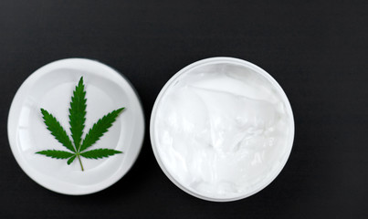 Cannabis ointment natural product. Cosmetic jar cream from natural hemp, lotion with CBD content. Copy space for your design
