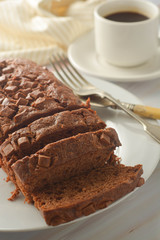 Chocolate pound cake. Homemade dark chocolate pastry for breakfast or dessert, bright background.