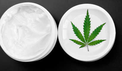 Cannabis ointment natural product. Cosmetic jar cream from natural hemp, lotion with CBD content. Copy space for your design