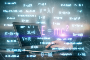 Science formula hologram with man working on computer on background. Education concept. Double...