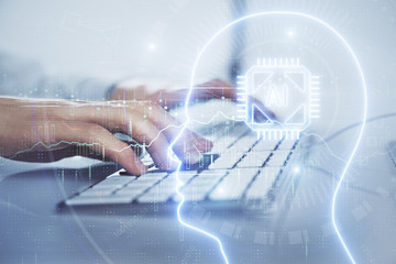 Businessman with computer background with brain theme hologram. Concept of brainstorm. Multi exposure.