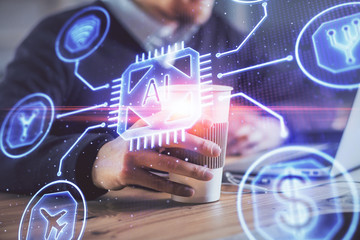 Double exposure of data internet theme hologram with man working on computer on background. Concept of innovation.
