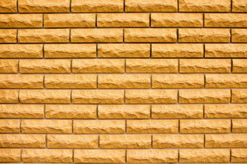 Fence made of yellow bricks