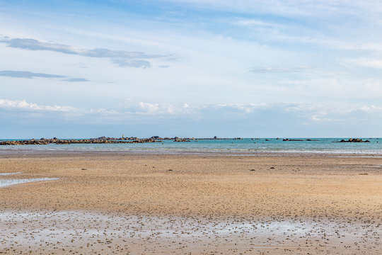 A sandy beach on the island of Jersey, on a sunny summers day