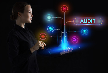 The concept of business, technology, the Internet and the network. A young entrepreneur working on a virtual screen of the future and sees the inscription: Audit