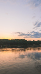 Fototapeta na wymiar beautiful sunset over the river, flying seagulls