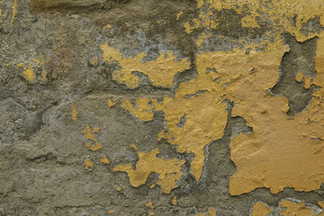Background of yellow and gray grungy brick wall