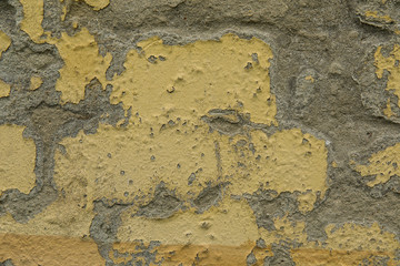 Achtergrond van gele en grijze grungy bakstenen muur