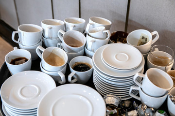 Dishes and cups of dirty coffee Waiting for cleaning.