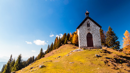 The Madonna della neve church in a colorful autumn