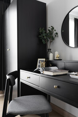 Dressing table corner with black wood power table and black wooden chair  decoration in natural...