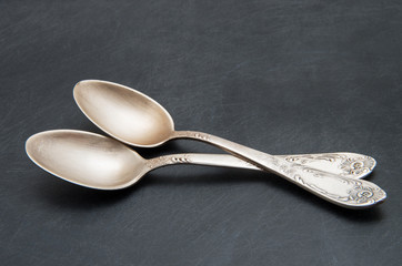 Vintage metal spoon on dark background