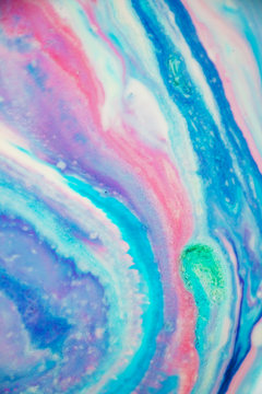 Abstract Purple, Blue and Pink Marbled Background and Texture. Beautiful colors, delicate swirls and interesting texture. Would make the perfect background for unicorn, mermaid or galaxy themes.