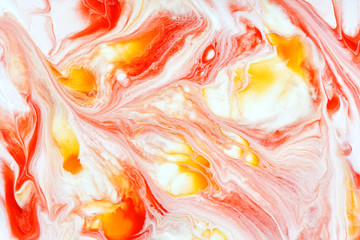 bright abstract background mixing red white yellow acrylic paints, fluid art