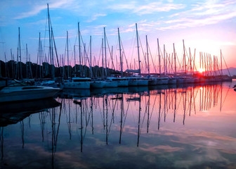 The rose sunrise in sea marina in Croatia with view on the sail boats
