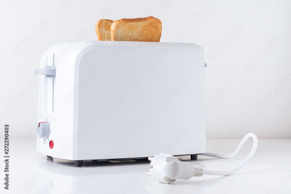 Poster toaster with roasted toast bread on white background, close up