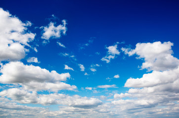 Naklejka na ściany i meble White clouds in blue sky.