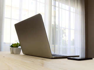 Desktop mockup with laptop and mobile phone