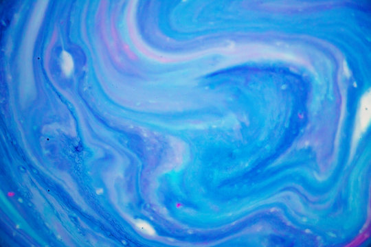 Abstract Purple, Blue and Pink Marbled Background and Texture. Beautiful colors, delicate swirls and interesting texture. Would make the perfect background for unicorn, mermaid or galaxy themes.