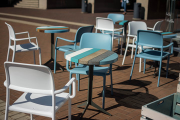 Fototapeta na wymiar chairs and tables summer city cafe